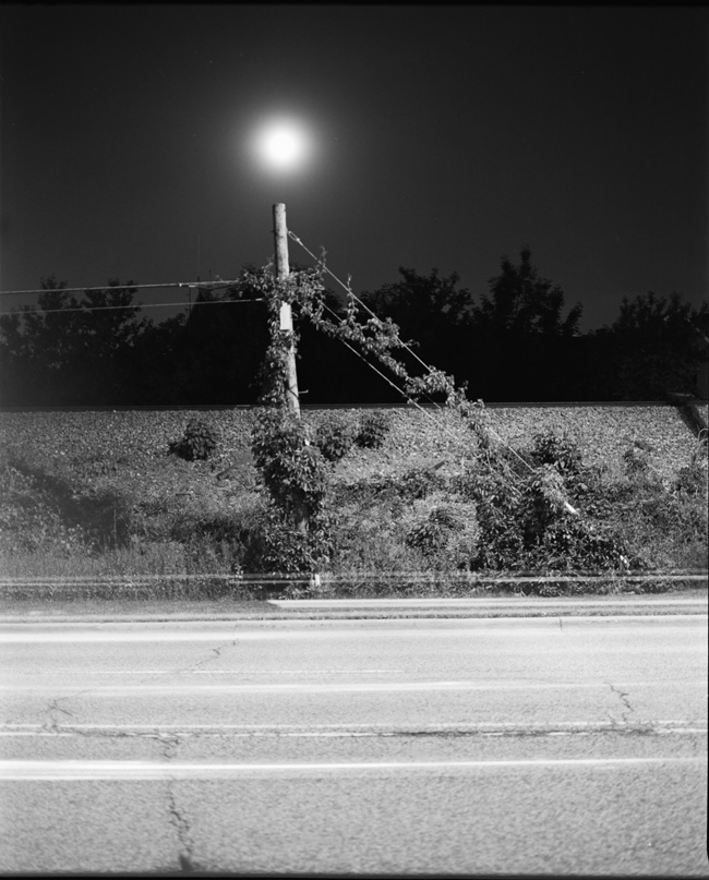 moon above electric pole
