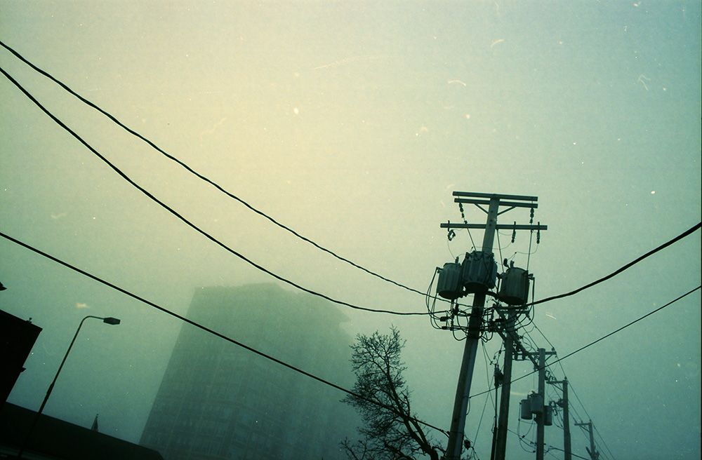Power Lines and Apartments in Fog