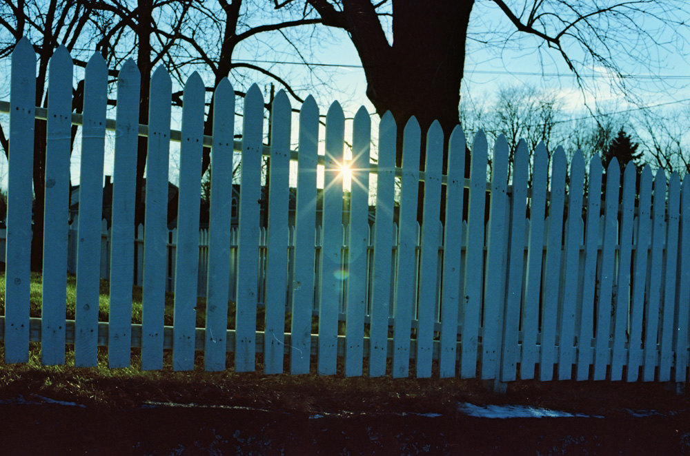 Sun Though Picket Fence